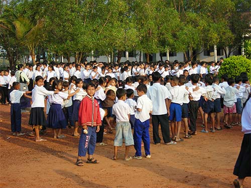 raising the cambodian flag at school in koh kong cambodia